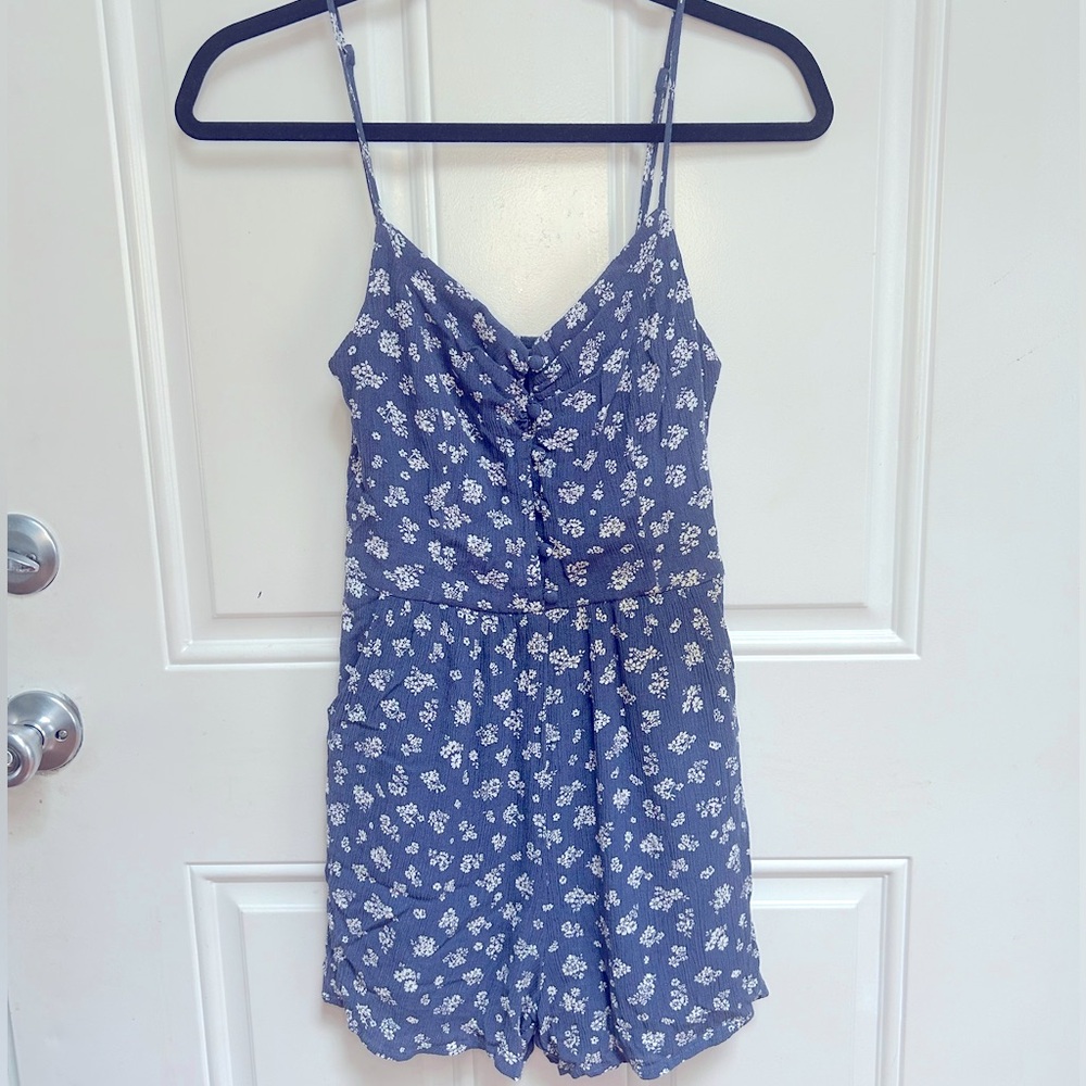 ONE CLOTHING small, blue floral romper.